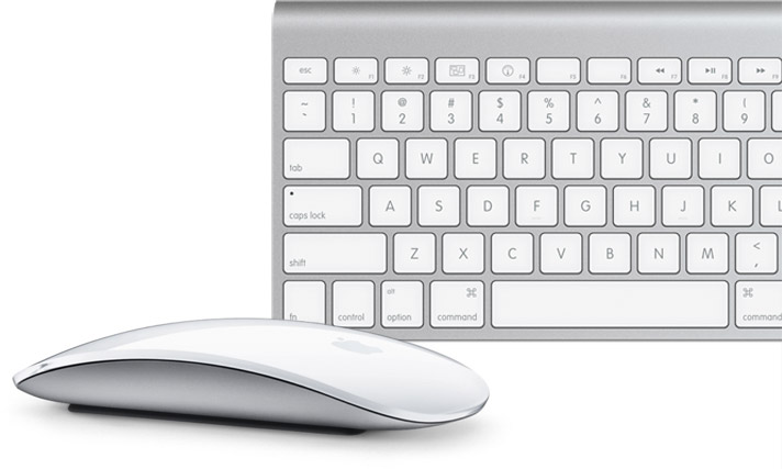 a white keyboard and mouse sitting next to each other