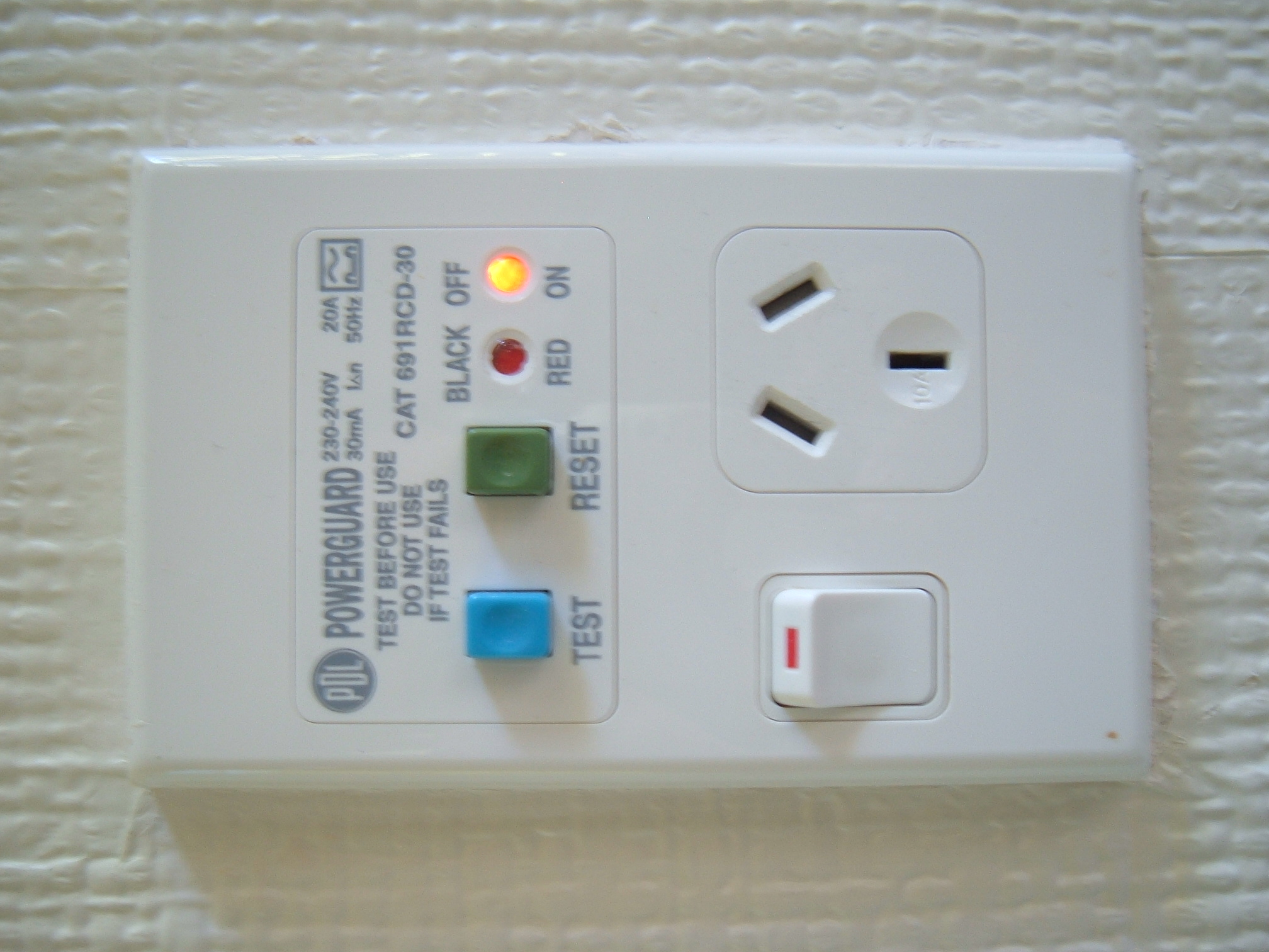 a white electrical device with red, green and blue lights