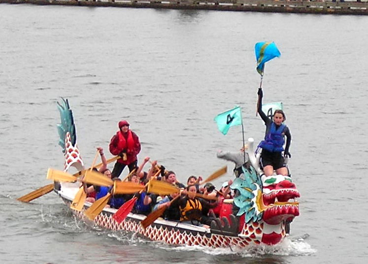 a group of people on a boat in the water