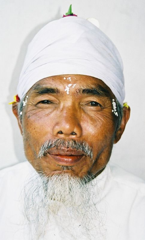 a man with white turban and eye patches