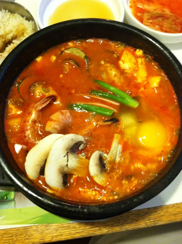 a large stew with many vegetables on it