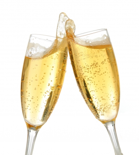 a close up of two glasses with champagne