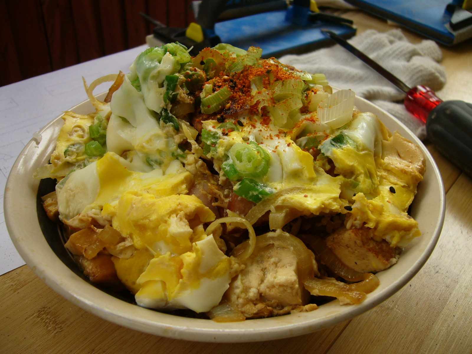 an asian noodle dish is shown in a bowl on a table