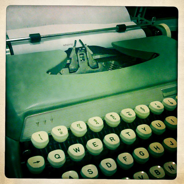 an old typewriter with words on it