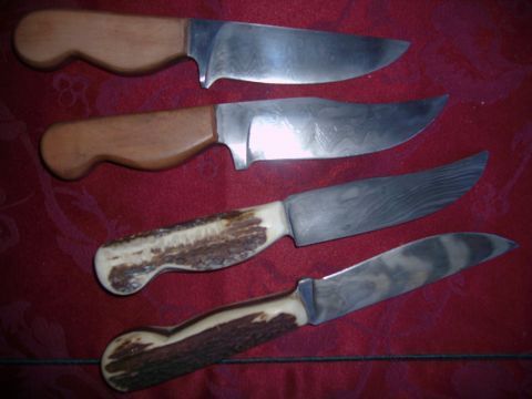 five knives laying on top of each other