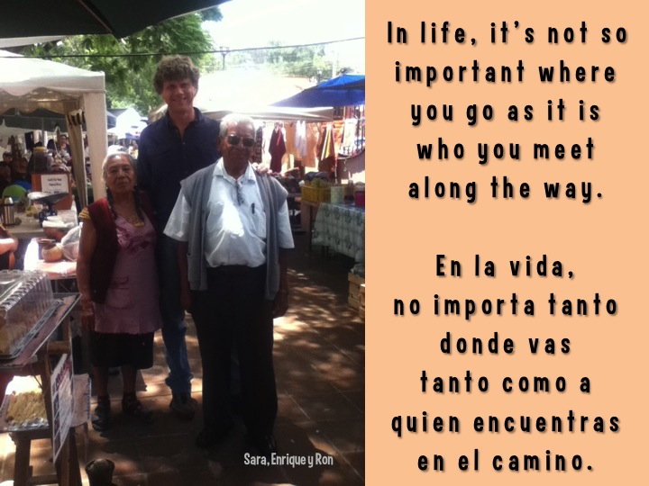 people standing under umbrella with quote about the life it's not so important where you go as if