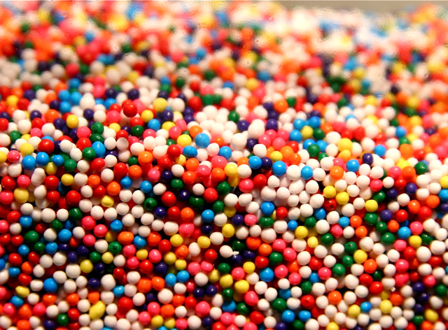 a group of colored beads stacked up together