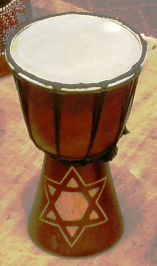 a close up of a djembe drum on a table