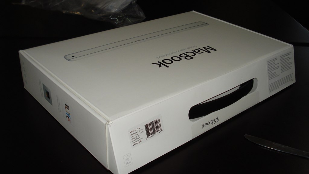 a white package sitting on top of a black table