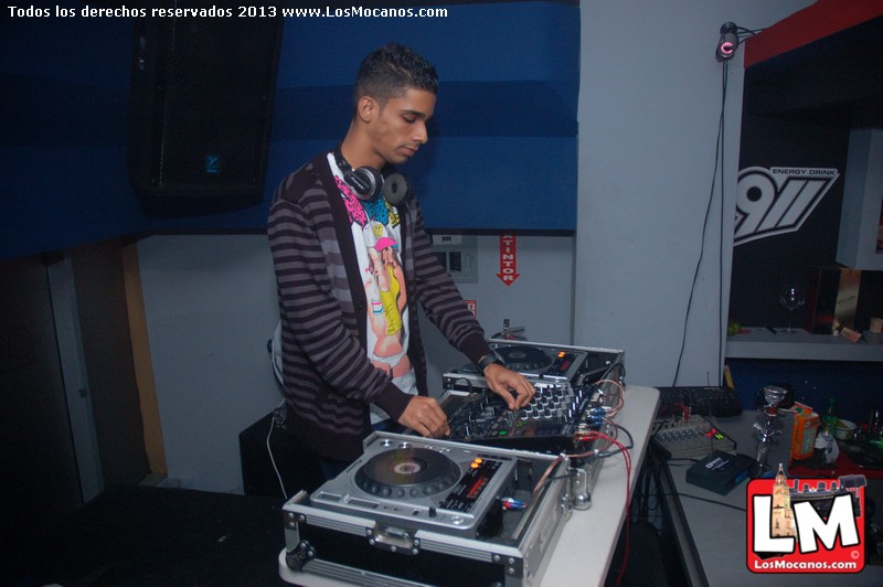 a man at a dj mixing in a club