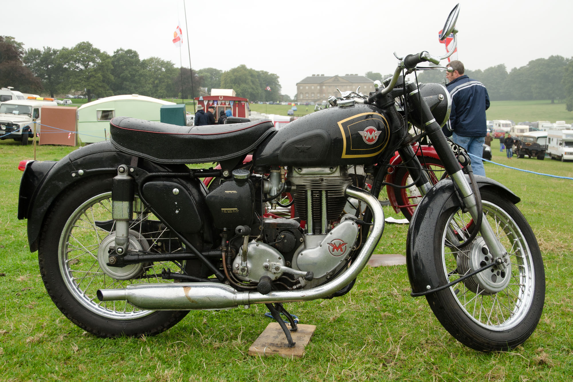 motorcycle displayed at outdoor event in urban area