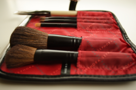 brush holder with two brushes inside of it