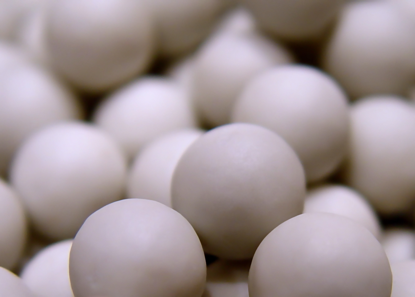 white balls are piled together and scattered around