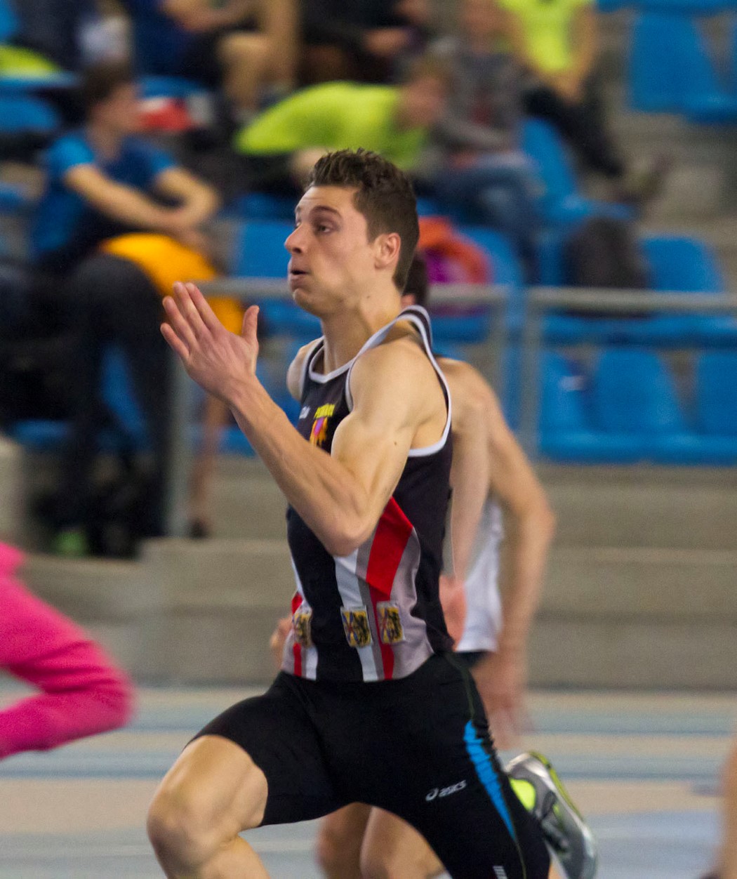 a male track and field athlete in motion