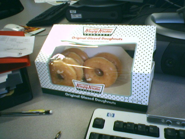 the krispy kreme glazed doughnuts are in the box