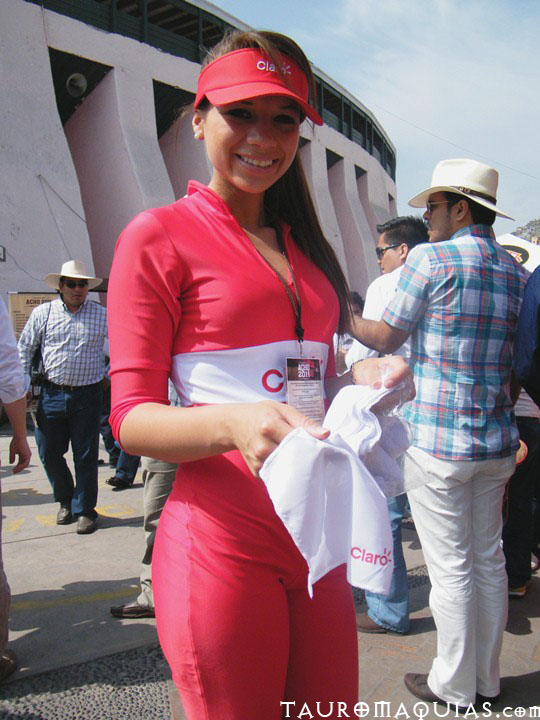 a woman wearing red poses for a po