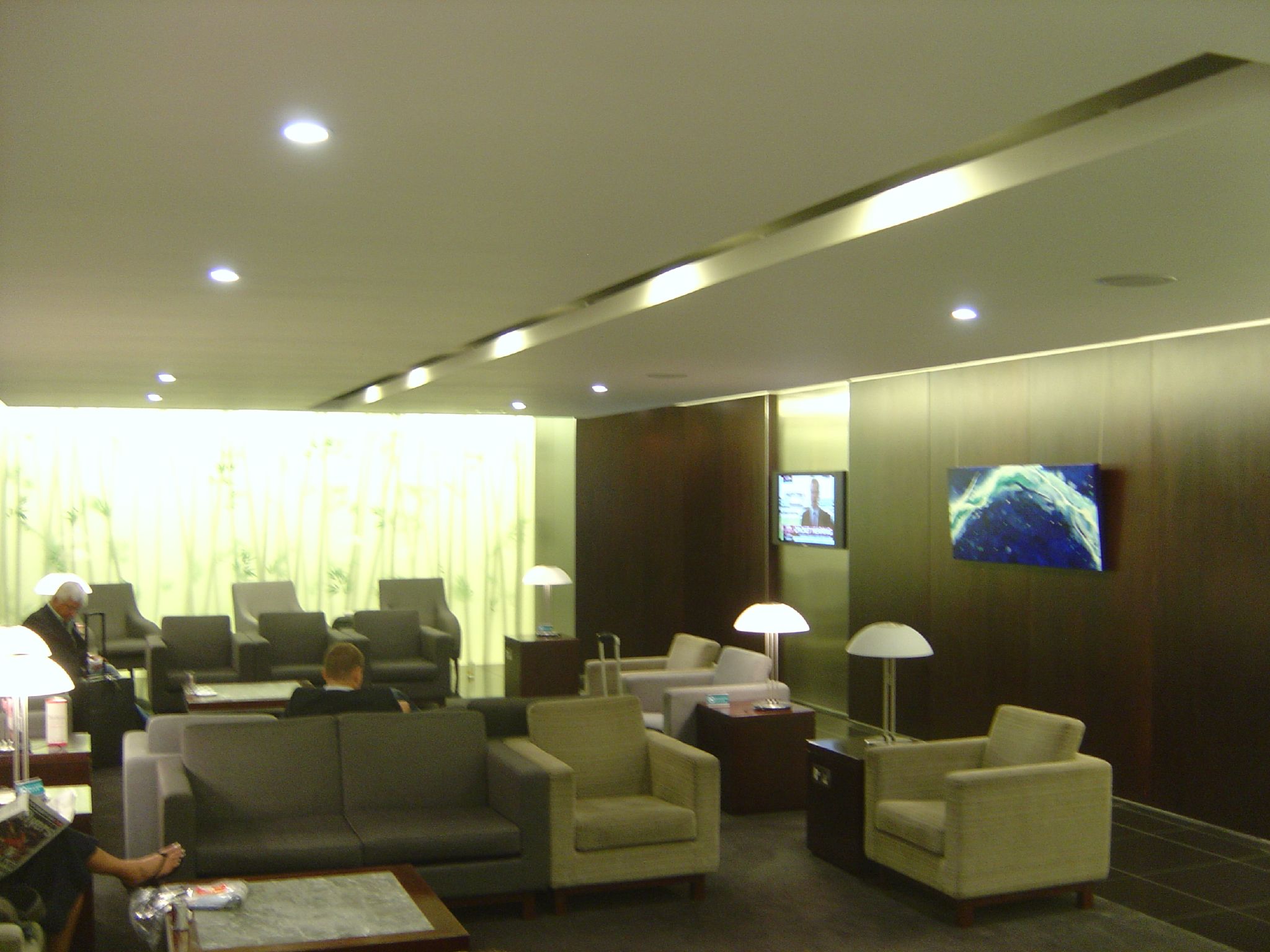 an interior view of a waiting area with couches and chairs