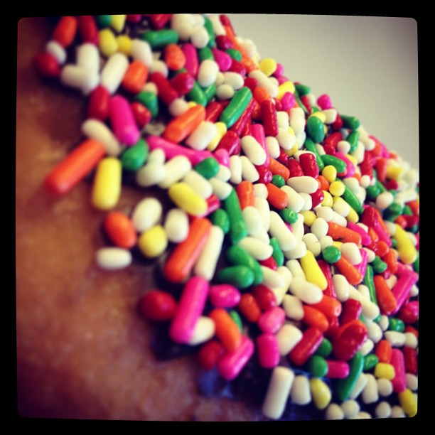 there are many sprinkles on the top of a donut