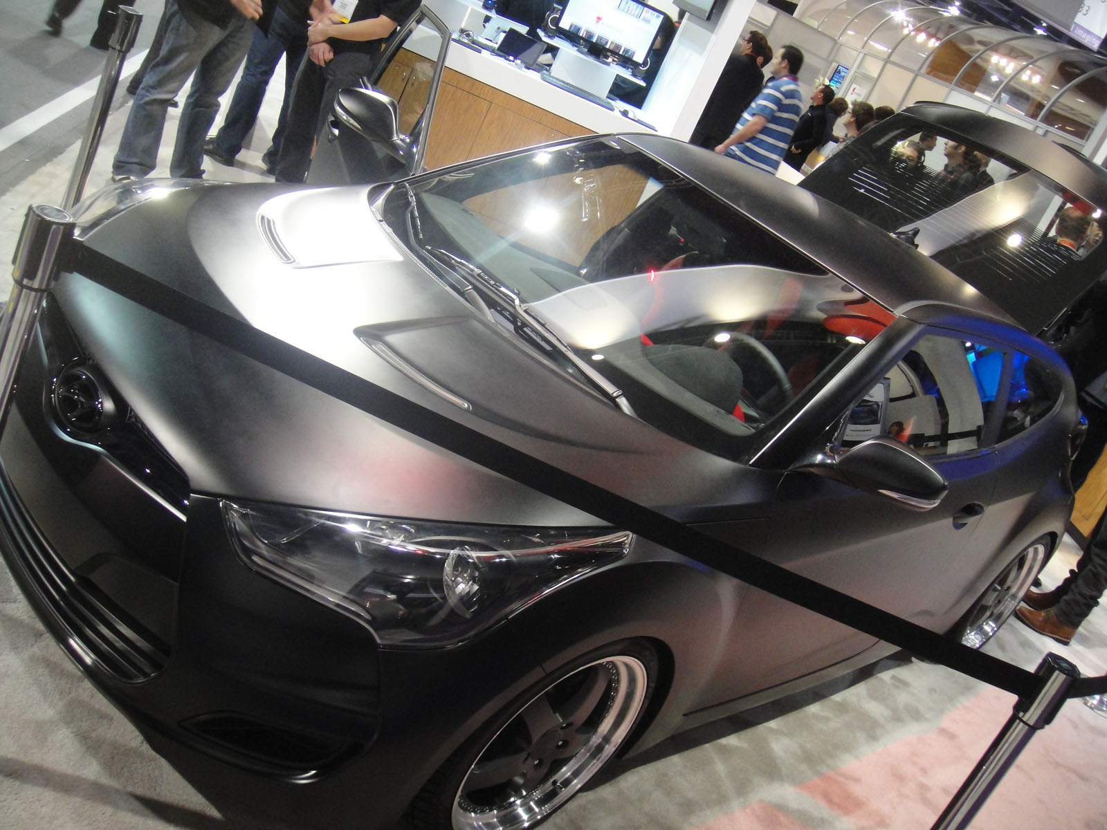 a very nice looking car on display at a convention