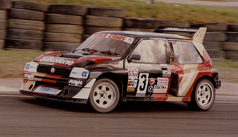 an automobile is making a turn on a racing track