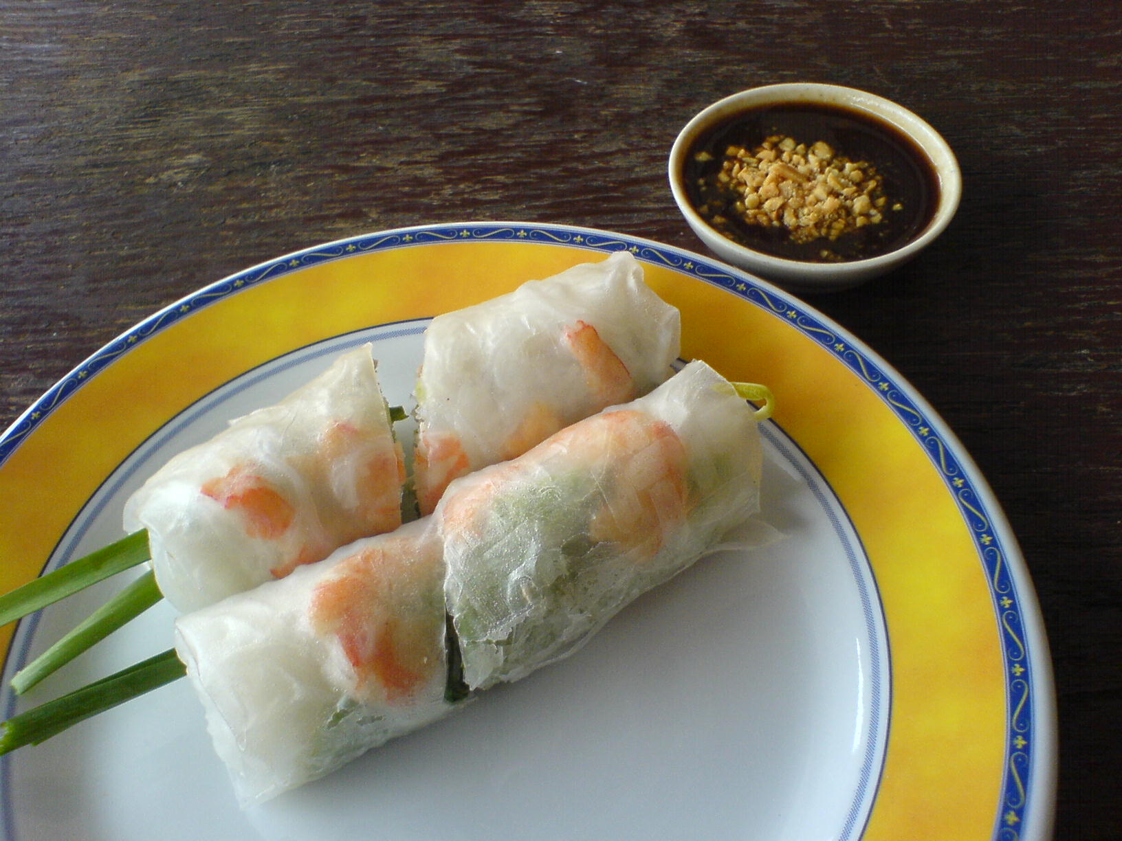 two vegetable spring rolls, served with dipping sauce