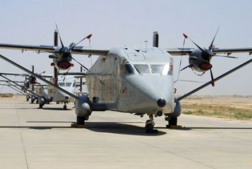 three air crafts are parked on a runway