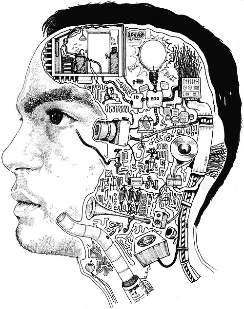 the image is a man's head with various electrical components on it