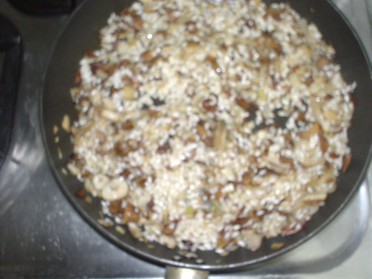a pan full of nuts on top of the stove