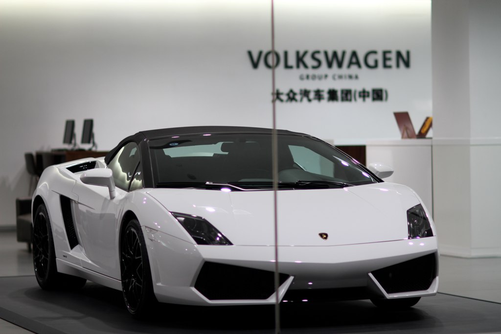 an all white lambino is on display inside a showroom