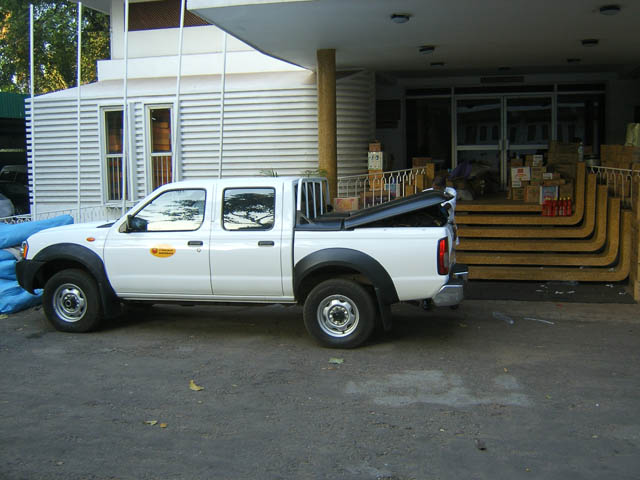 a white truck parked in front of a house