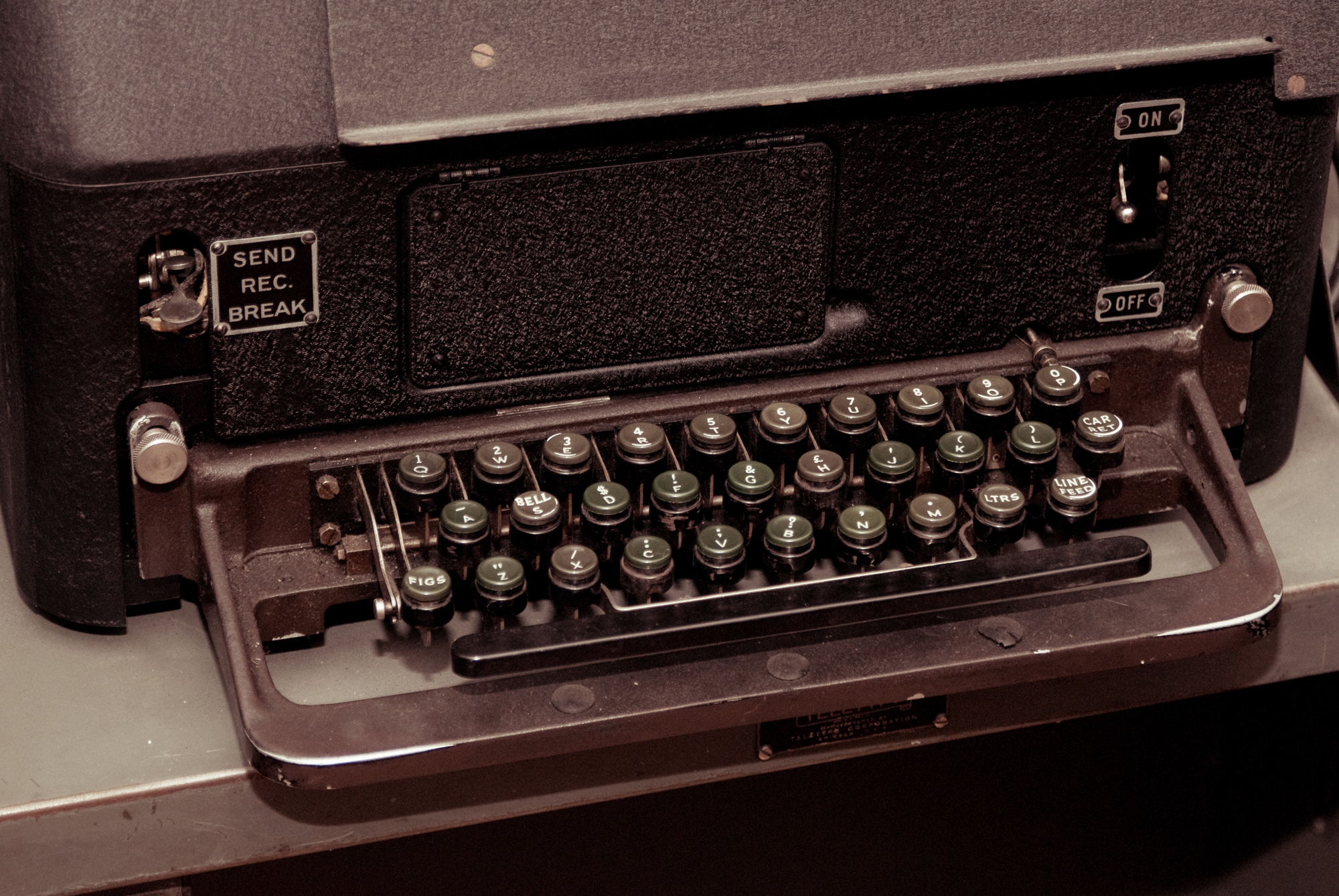 an old fashioned typewriter on a table