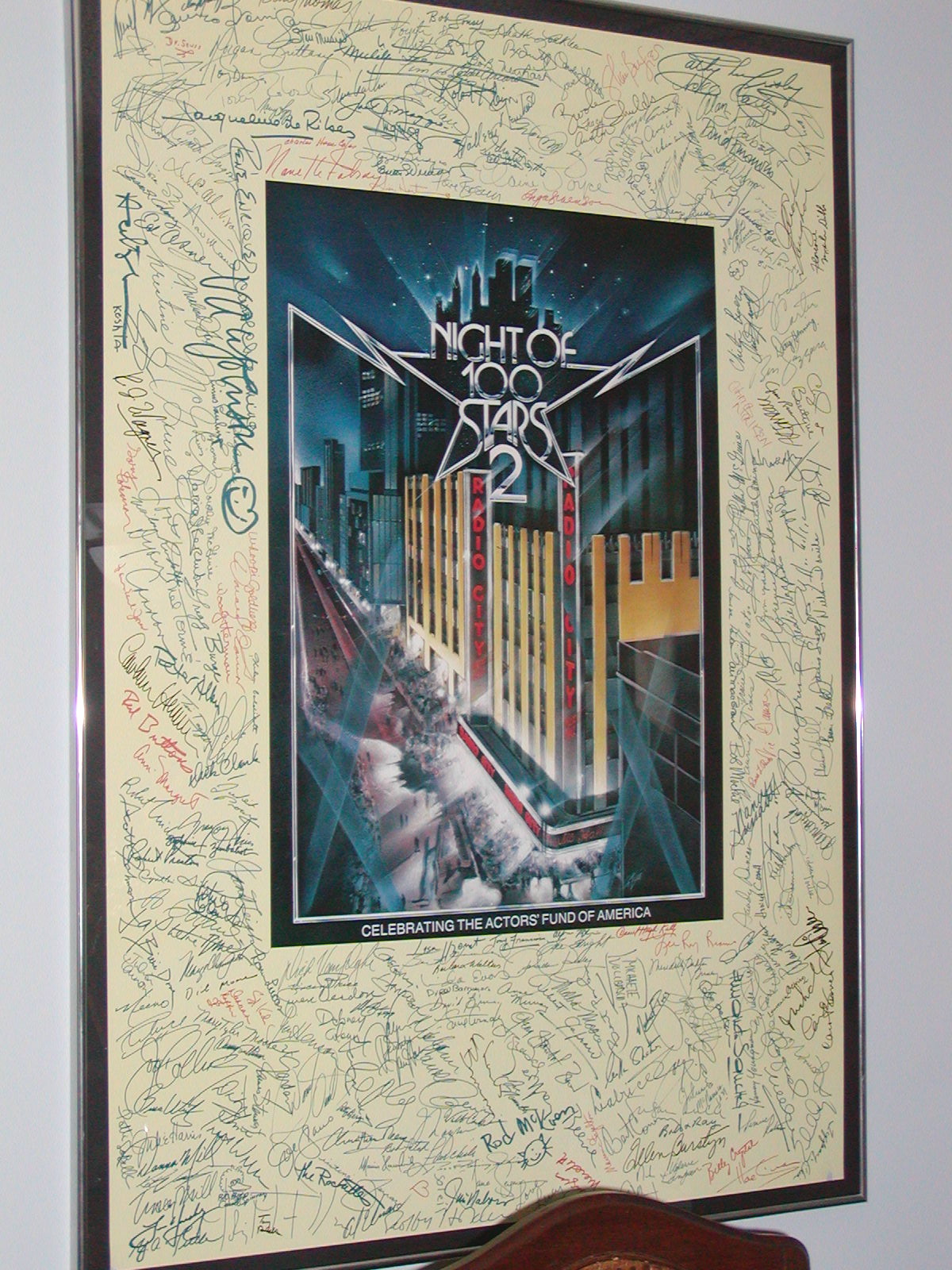 a framed poster on the wall of an apartment