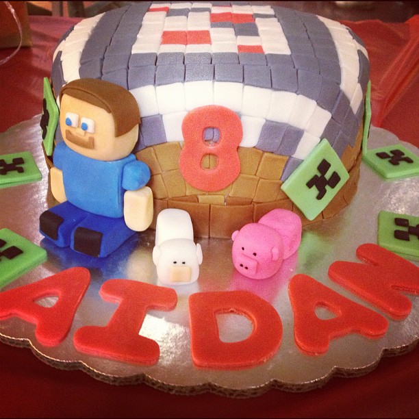 a birthday cake that has the number eight and a boy