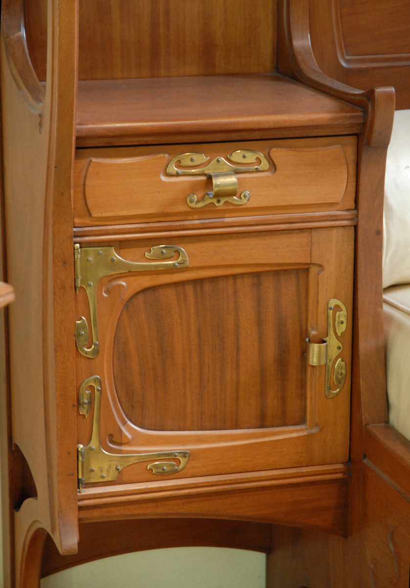 a cabinet with many small pieces of wood on it