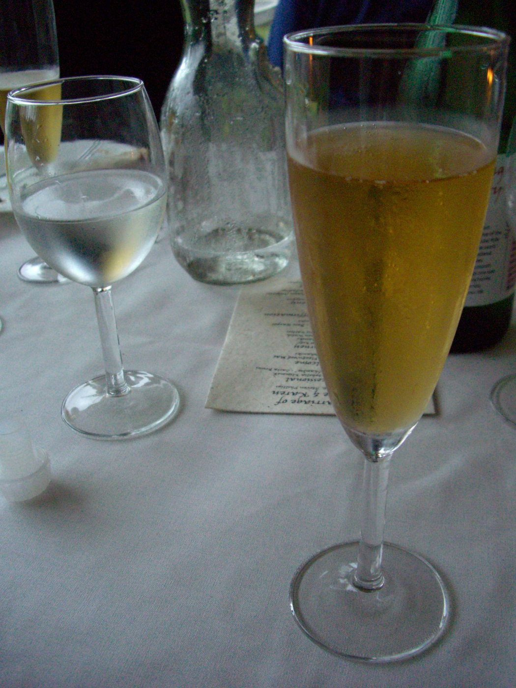 several glasses on a table are full with wine