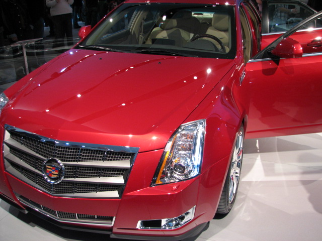 a red cadillac on display at an event