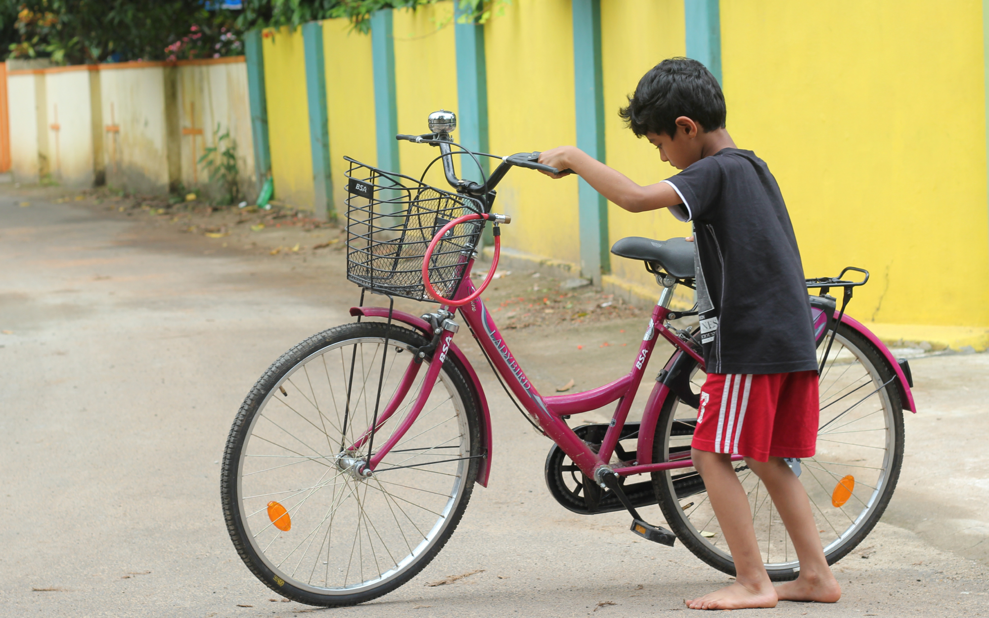 a  standing next to a bike