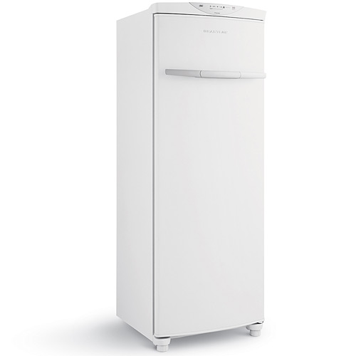 a white refrigerator sitting in the middle of the room