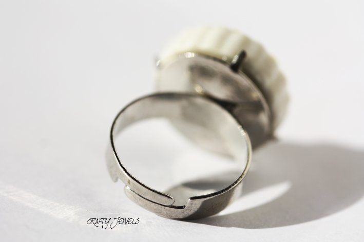 an odd shaped ring on a white surface