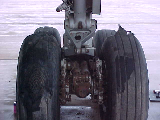 an airplane is shown with large wheels attached