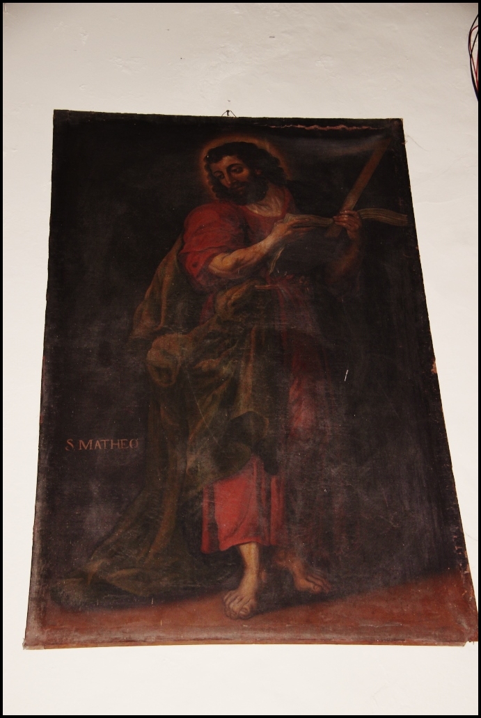 a painting of jesus holding a cross is shown