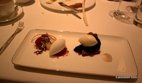 a close up of two desserts on a plate