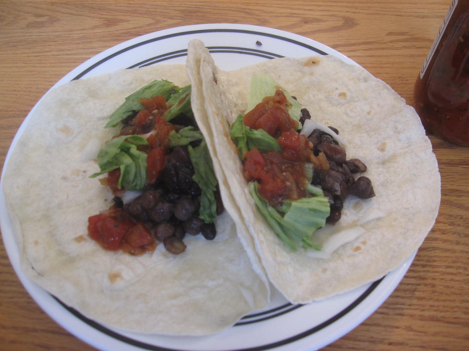 two tortillas sitting on top of a white plate