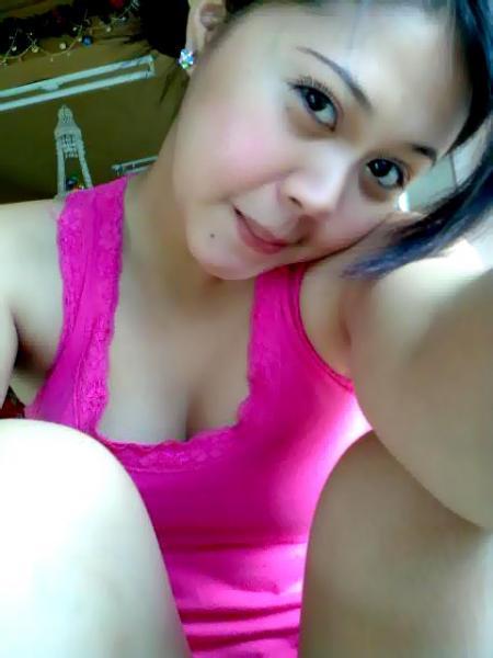 a  smiling in her pink tank top