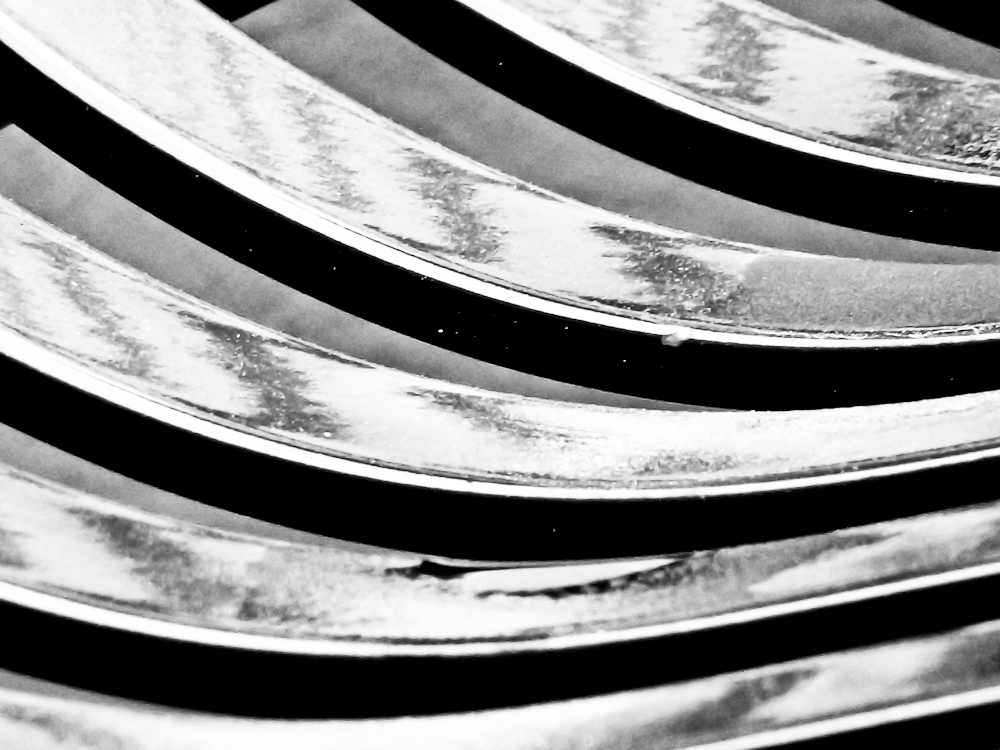 several forks stacked next to each other in close up