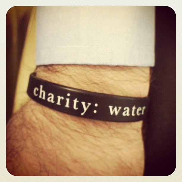 a wristband that says charity water on it