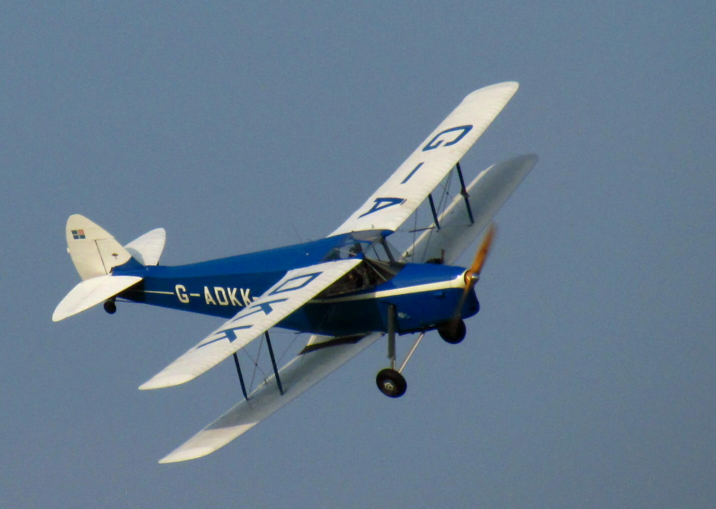 a small plane that is flying in the sky