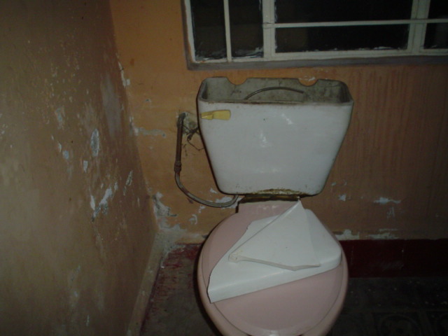 an old toilet with paper on it
