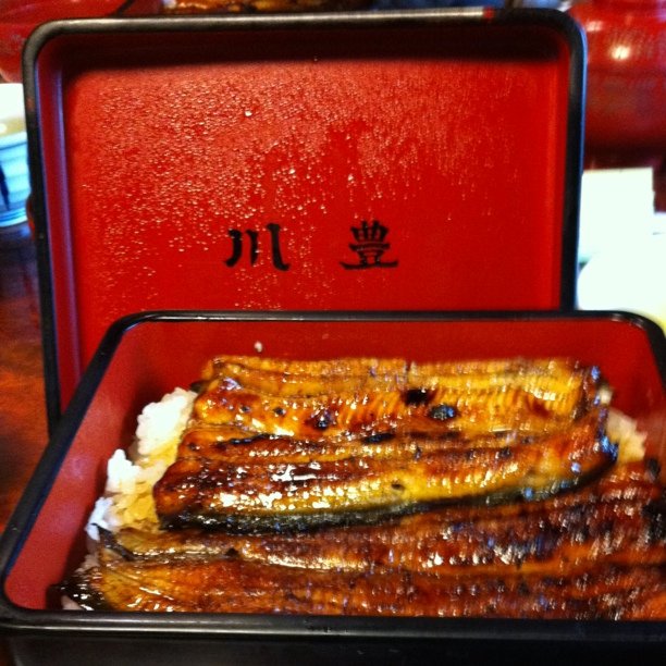 food and dessert items arranged in square trays