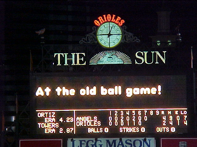 the scoreboard at night with some lights in it